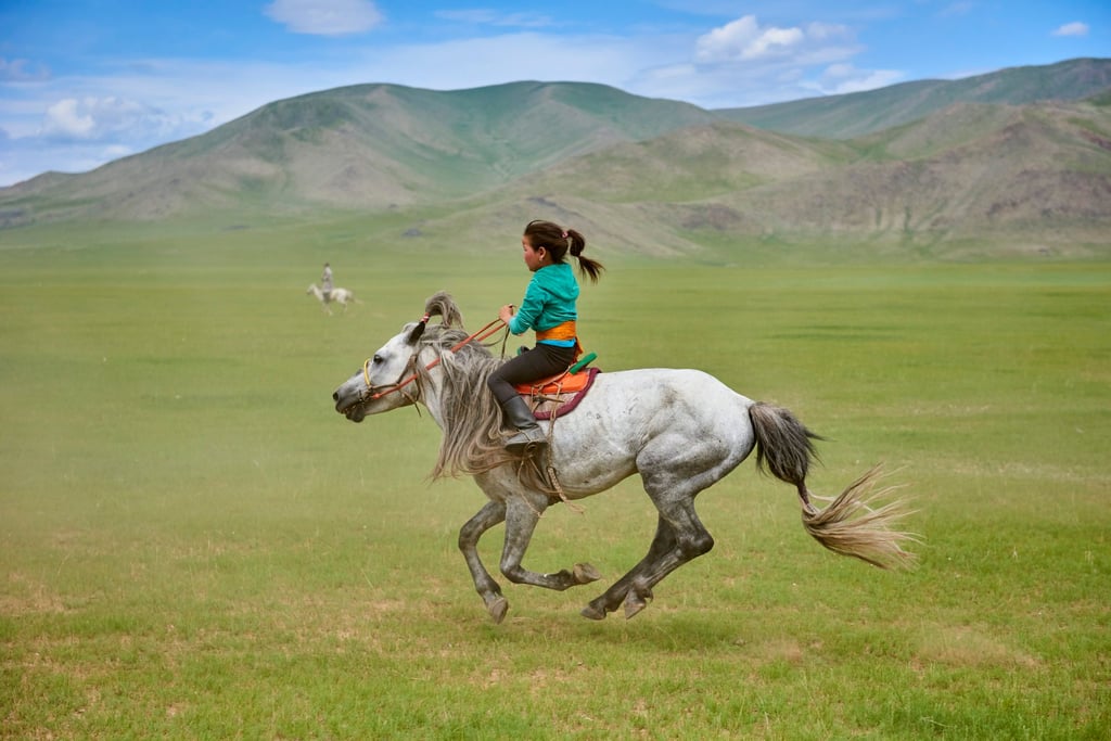 Horse racing during the traditional festival of Naadam in Bayankhongor province, Mongolia, Bayankhongor province. Photo: Getty Images