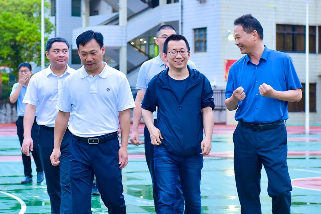 Zhang Yiming (second from right) visited his old school, Yongding No 1 Middle School in Fujian, in June 2021. Photo: Handout Zhang Yiming (second from right) visited his old school, Yongding No 1 Middle School in Fujian, in June 2021. Photo: Handout