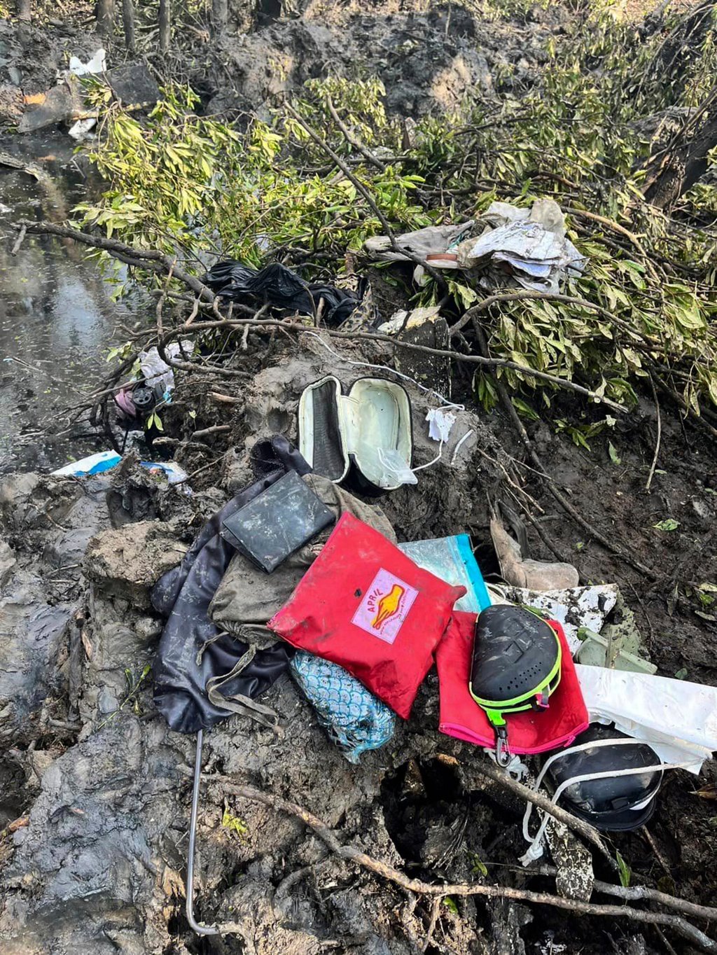 Passengers’ belongings are seen at the crash site on Thursday. Photo: Chachoengsao’s Public Relations Department via AP