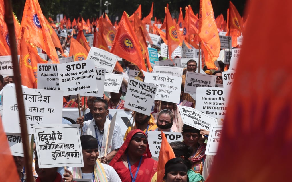 Members of the Nari Shakti Forum and their supporters take part in a protest march against alleged atrocities on Bangladeshi Hindus and other minorities, in New Delhi on August 16. Photo: EPA-EFE