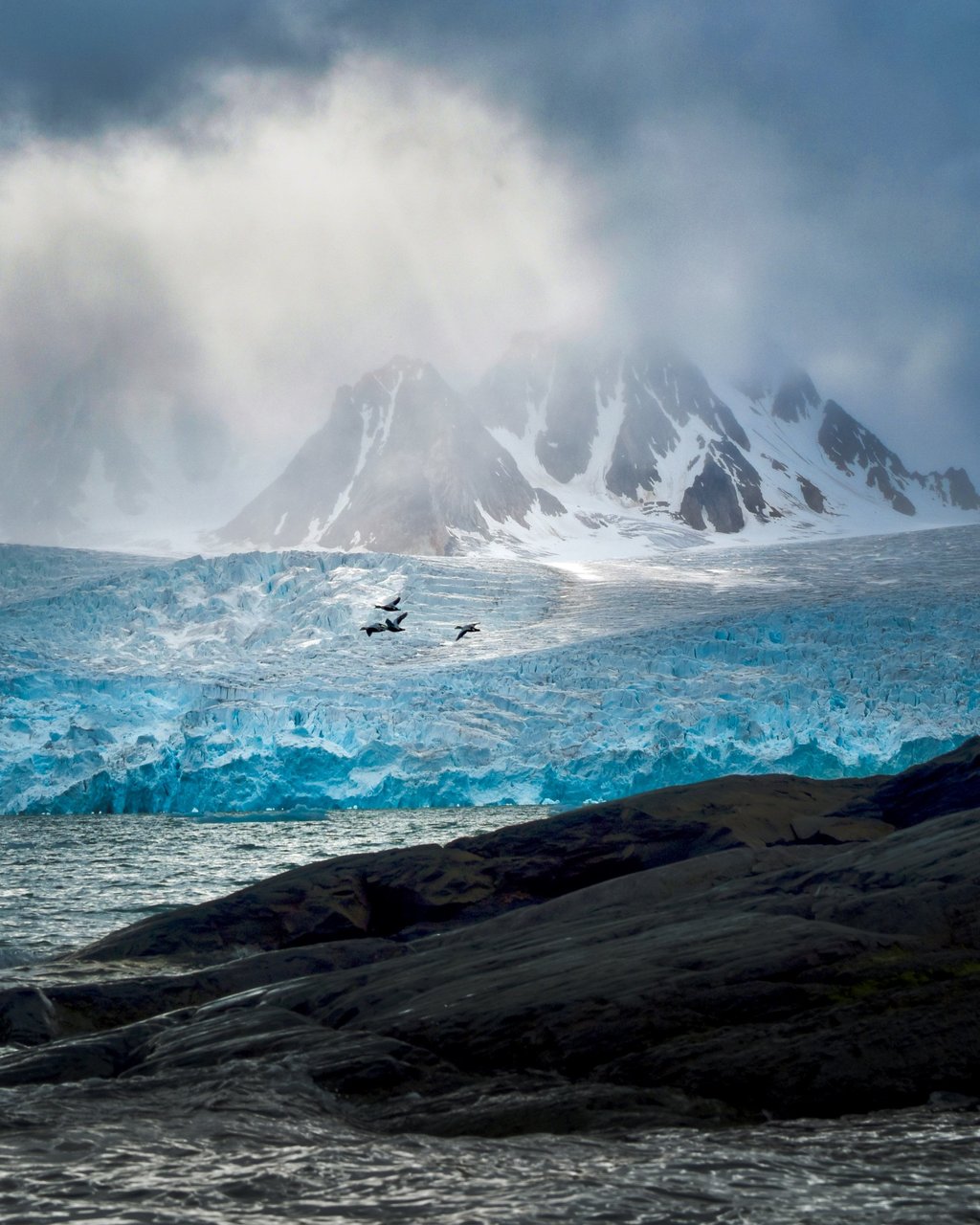 Dramatic light over Seligerbreen, one of four glaciers that debouche into the 30-km-long Liefdefjorden (“Love Fjord”). Photo: Victoria Burrows