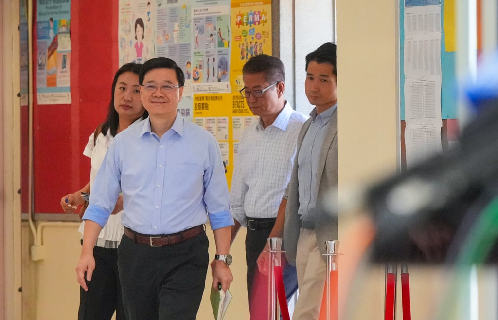 Chief Executive John Lee (second left) has said certain industries have been struggling to survive during the period of economic transition. Photo: May Tse