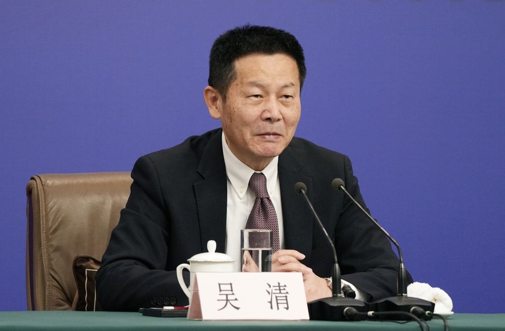 Wu Qing, chairman of the China Securities Regulatory Commission, speaks at a news conference in Beijing in March 2024. Photo: Bloomberg