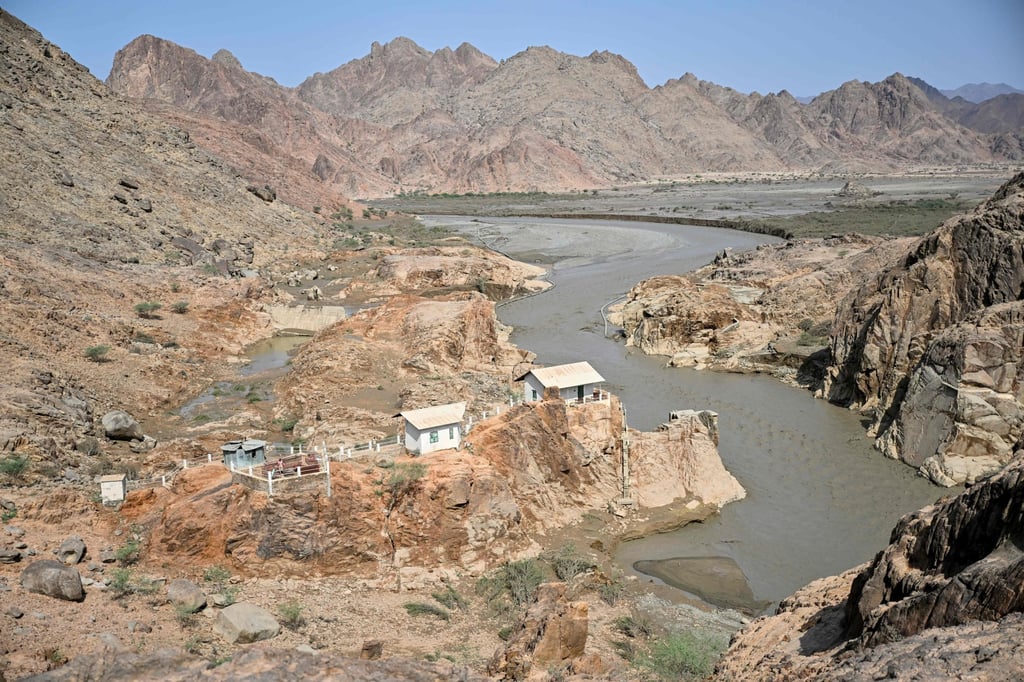 Buildings near the Arbaat Dam after it collapsed. Photo: AFP