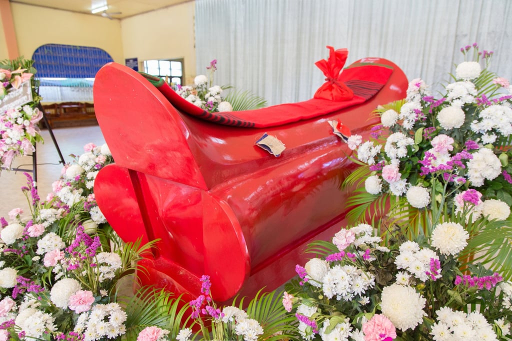 A red wooden coffin at a Chinese funeral. Photo: Shutterstock