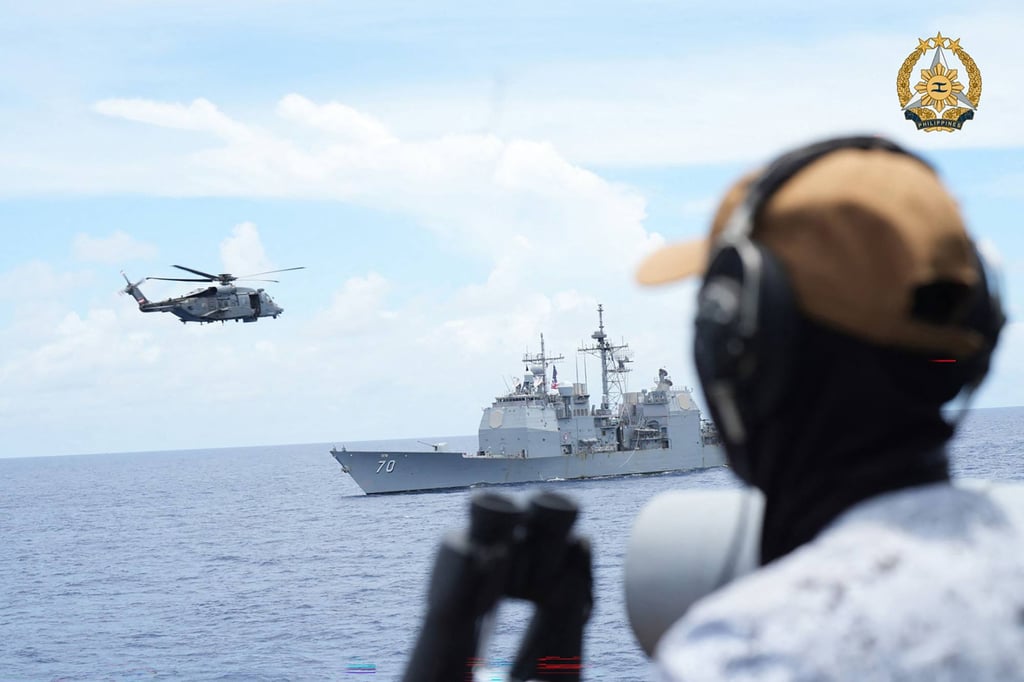 A Sikorsky CH148 Cyclone helicopter approaches the USS Lake Arie during joint drills involving the Philippines, US, Canada, and Australia in the South China Sea. Photo: AFP