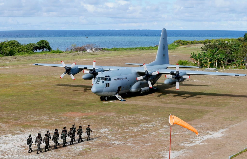A Philippine Air Force C-130 transport plane and Philippine troops on Thitu Island off the disputed Spratlys chain of islands in the South China Sea in 2017. File photo: AP