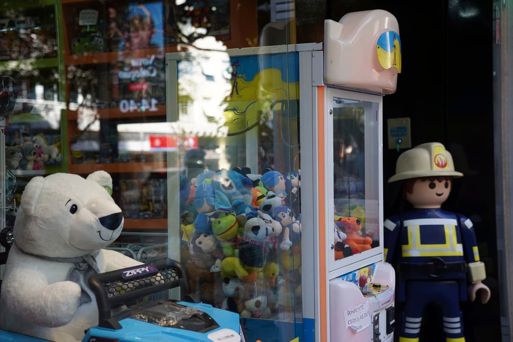 A claw machine at a toy store in Rio de Janeiro. The Rio police press office said they were carrying out search warrants targeting claw machines because they are considered games of chance and therefore illegal. Photo: AP A claw machine at a toy store in Rio de Janeiro. The Rio police press office said they were carrying out search warrants targeting claw machines because they are considered games of chance and therefore illegal. Photo: AP
