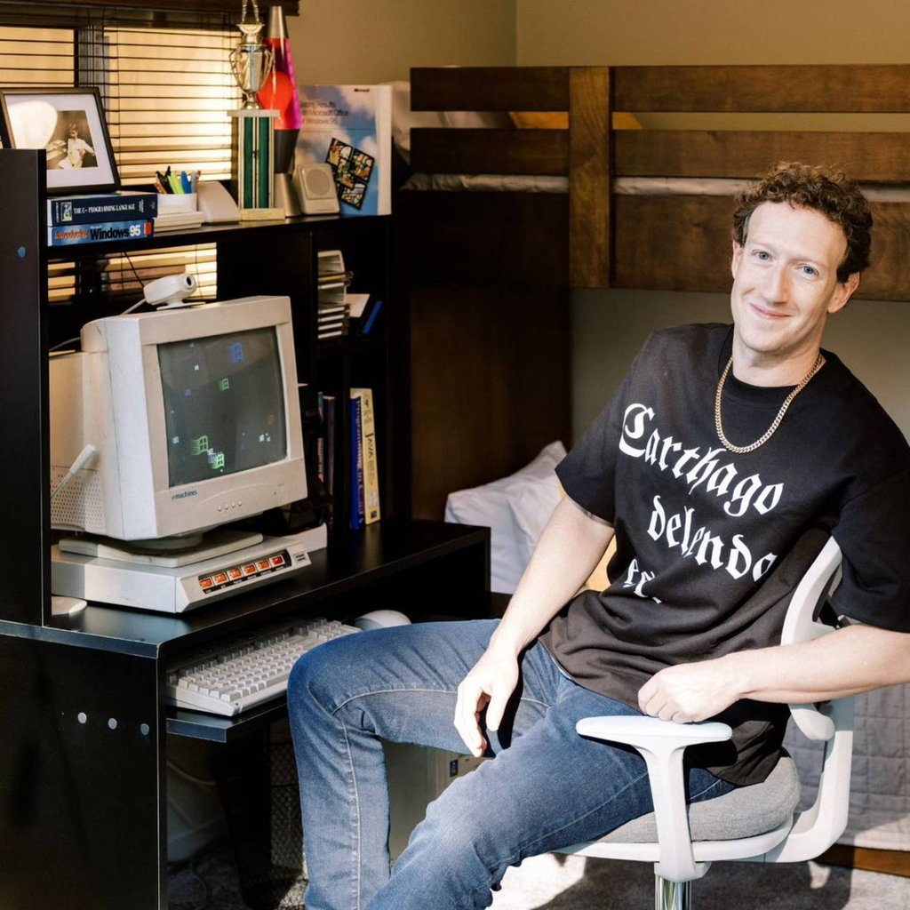 Fashionable throwback? For his 40th birthday party, Mark Zuckerberg went full 90s rapper in a chain and slogan T-shirt over jeans and trainers. Photo: @Zuck/Instagram