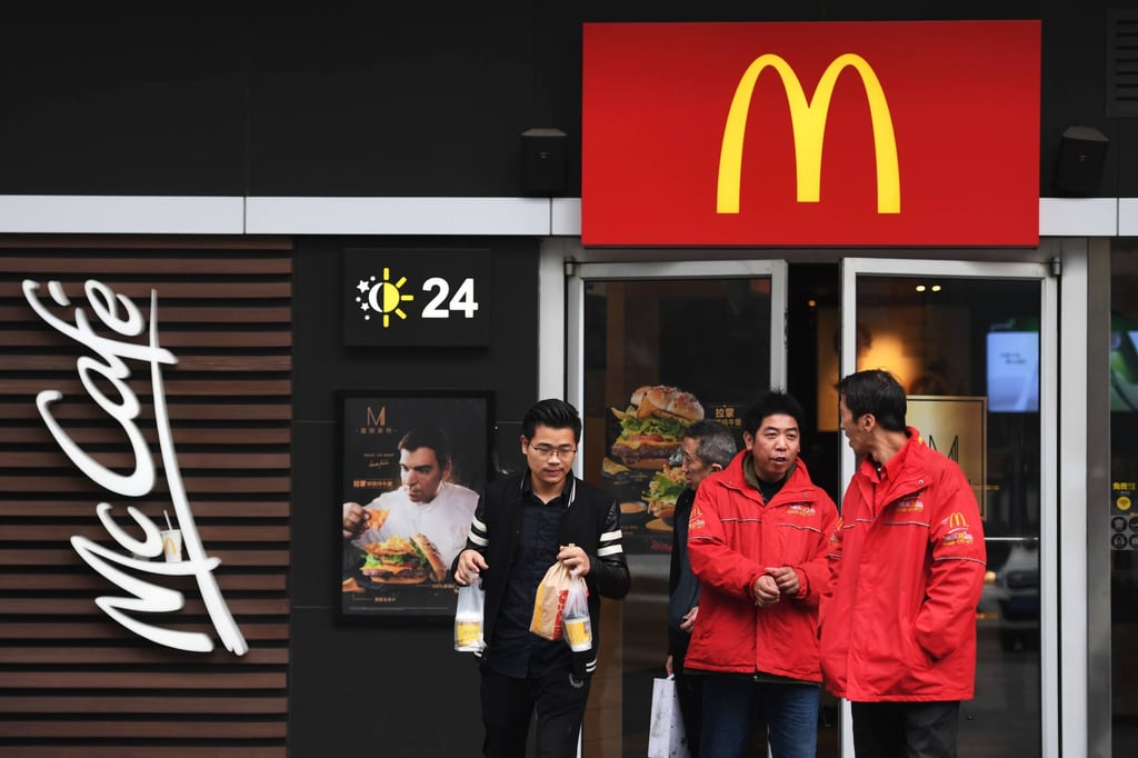 People exiting from a McDonald’s restaurant in Beijing in Jaonary 2020 before the Covid-19 outbreak. Photo: AFP