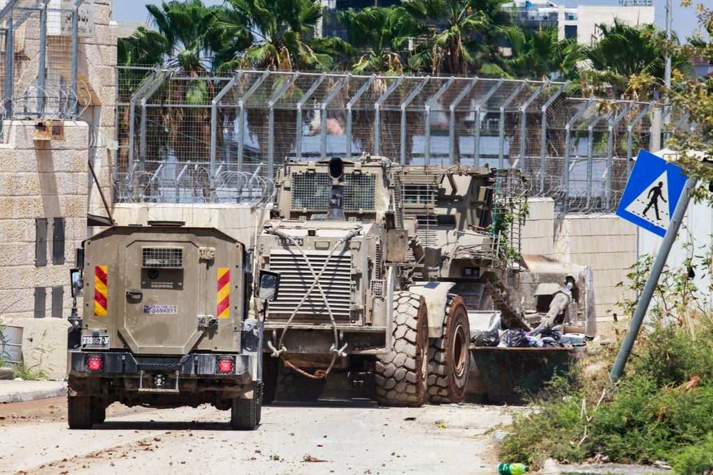 Military vehicles patrol as the Israeli offensive continues on Jenin refugee camp on Saturday. Photo: dpa