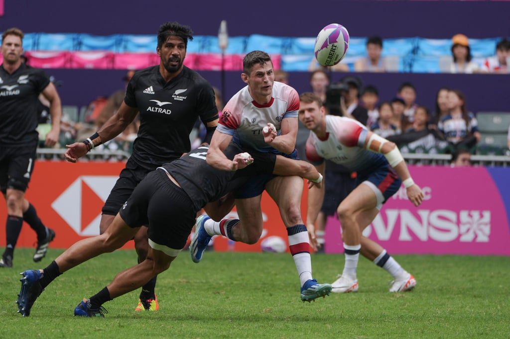 Great Britain’s Robbie Fergusson (second from right) is tackled while facing New Zealand at the 2024 Rugby Sevens. Photo: Eugene Lee