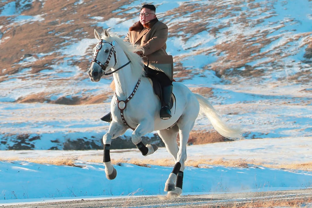 North Korean leader Kim Jong-un rides a white horse to climb Mount Paektu. Russia reportedly sent two dozen horses to its neighbour in exchange for artillery shells. Photo: KCNA/KNS/AP