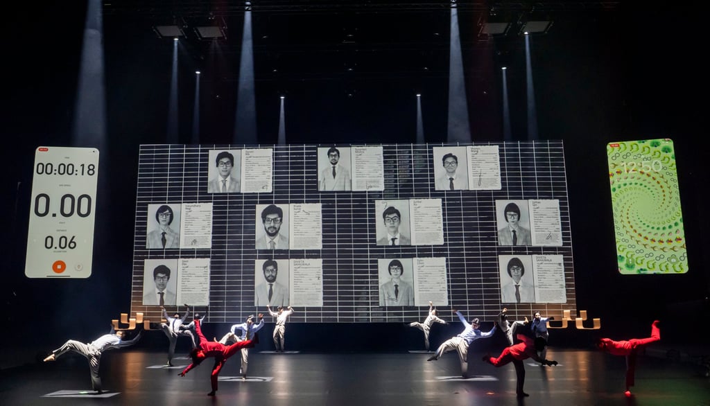 Performers from two different dance troupes, one based in Shanghai and the other in Mumbai, respond to and interact with the data shown on a large screen during the show. Photo: Tristram Kenton