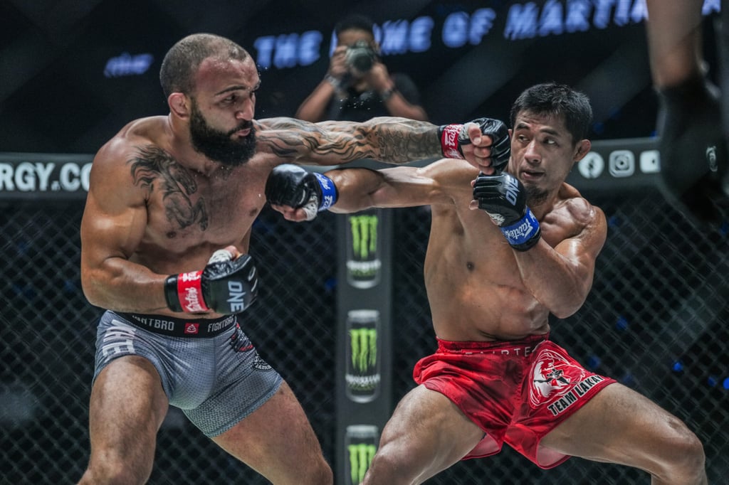 John Lineker punches Stephen Loman during their bout at ONE Fight Night 14, which Lineker won via unanimous decision. Photo: ONE Championship