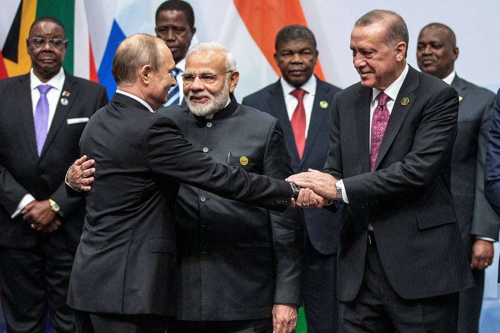 Russian President Vladimir Putin, Indian Prime Minister Narendra Modi and Turkish President Tayyip Erdogan interact before a picture at the Brics summit in Johannesburg, South Africa, in July 2018. Photo: Pool/Reuters