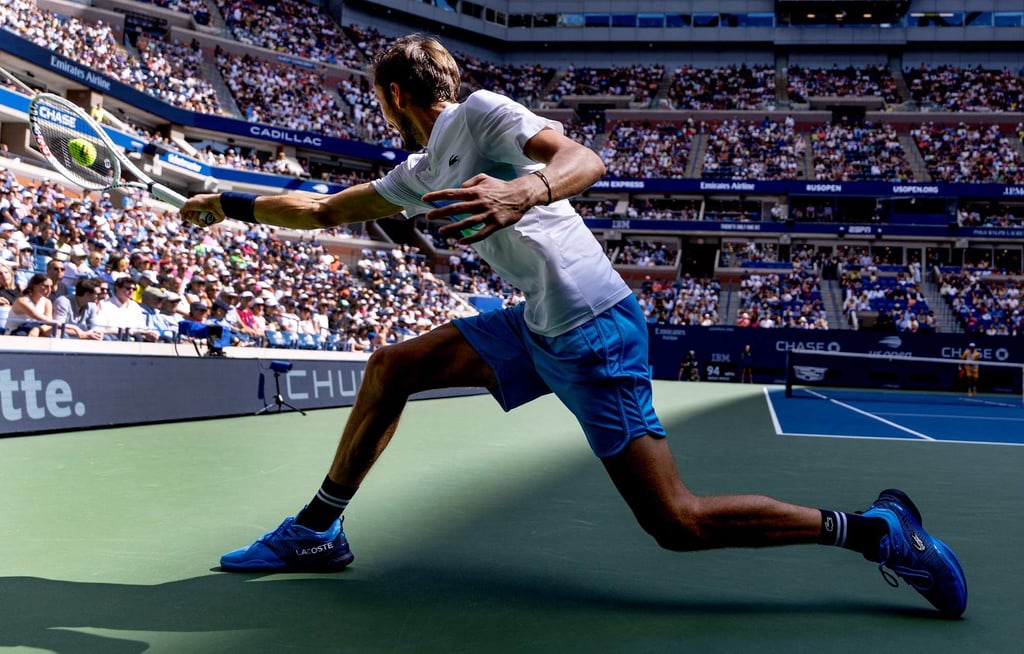Russia’s Daniil Medvedev returns against Nuno Borges of Portugal in a straightforward win. Photo: AFP Russia’s Daniil Medvedev returns against Nuno Borges of Portugal in a straightforward win. Photo: AFP