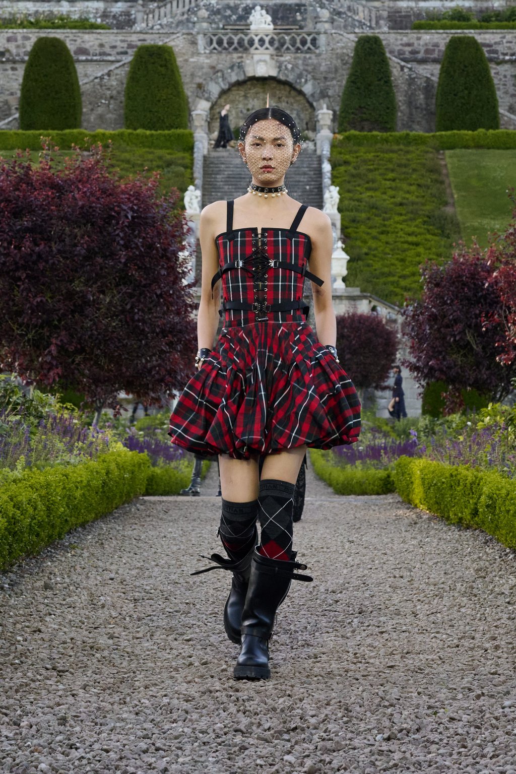 A tartan outfit is presented at the Dior Cruise 2025 show at Scotland’s Drummond Castle. Photo: Handout