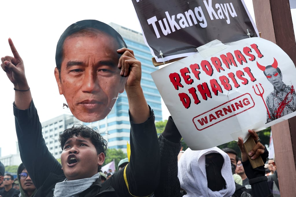 A demonstrator holds a cut-out of Widodo during a protest last month outside parliament against revisions to Indonesia’s election law. Photo: Reuters
