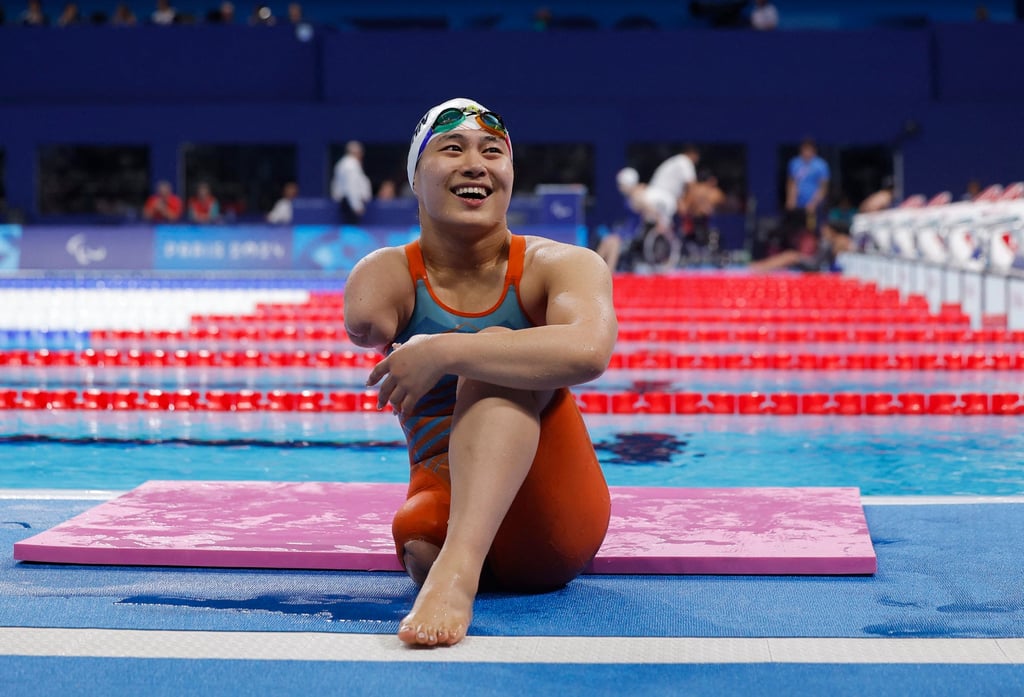 Jiang Yuyan takes a moment after winning her sixth gold of the Paralympics in Paris. Photo: Reuters