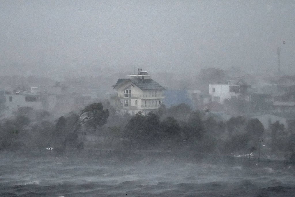 Water is whipped up by high winds onto the shore of Phuong Luu lake as Super Typhoon Yagi hits Hai Phong on September 7, 2024. Super Typhoon Yagi uprooted thousands of trees and swept ships and boats out to sea as it made landfall in northern Vietnam on September 7, state media said. (Photo by NHAC NGUYEN / AFP) Water is whipped up by high winds onto the shore of Phuong Luu lake as Super Typhoon Yagi hits Hai Phong on September 7, 2024. Super Typhoon Yagi uprooted thousands of trees and swept ships and boats out to sea as it made landfall in northern Vietnam on September 7, state media said. (Photo by NHAC NGUYEN / AFP)