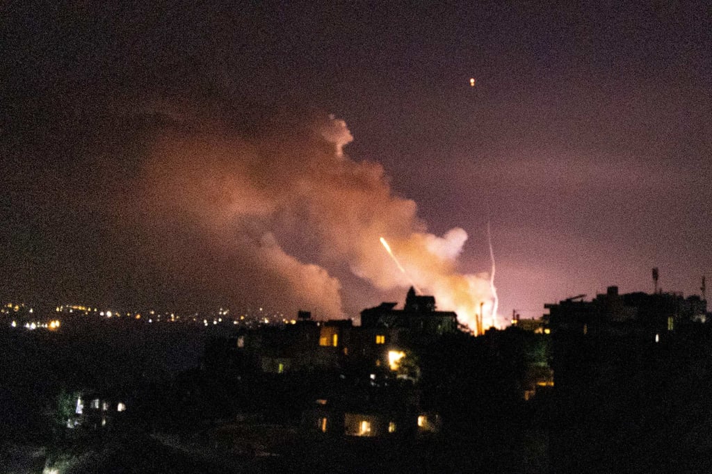 Smoke rises following an Israeli strike on a target between the villages of Ghandourieh and Froun in southern Lebanon late on Friday. Photo: AFP