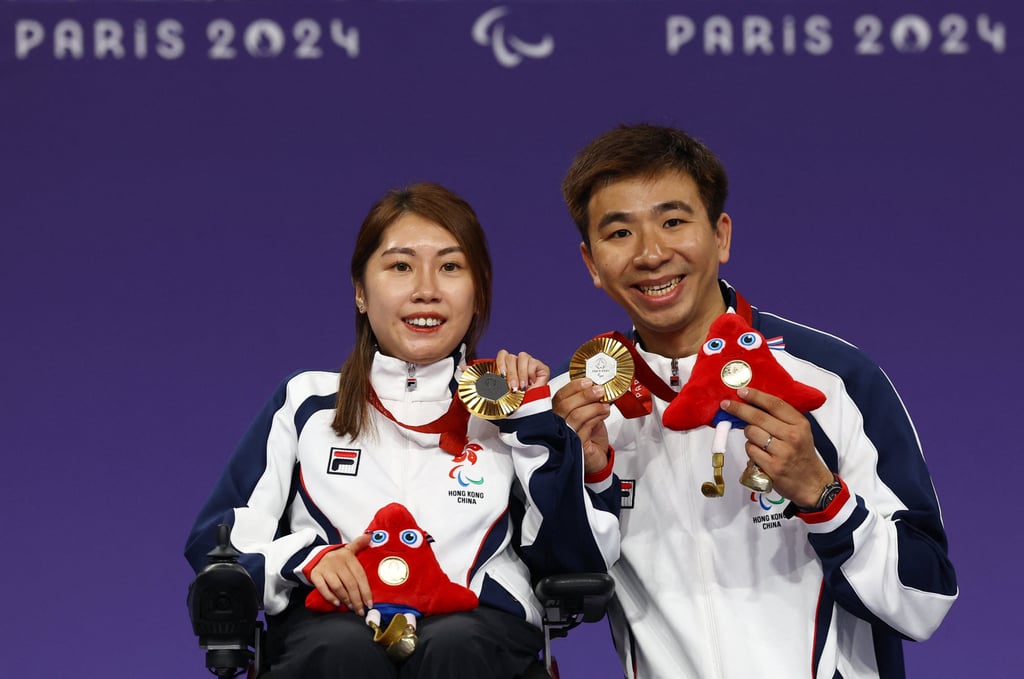 Ho Yuen-kei (left) won two gold medals in boccia at the Paris Paralympics, with husband Lee Wing-kit acting as her ramp operator. Photo: Reuters