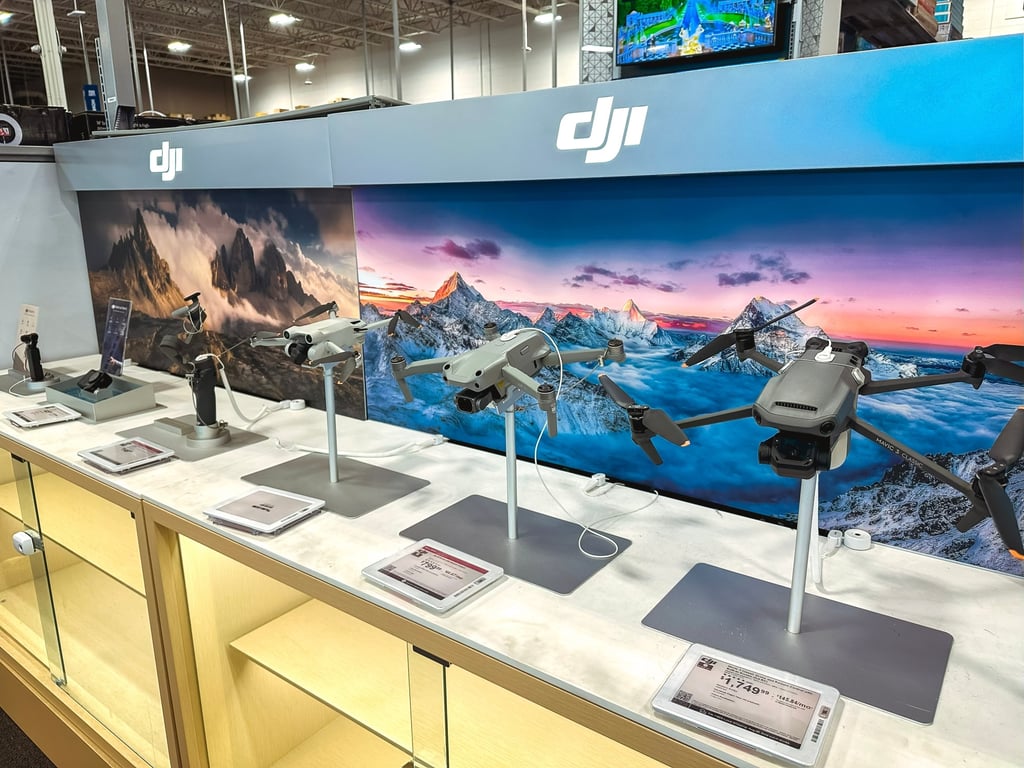 A variety of DJI drones are showcased with pricing information at a US retail electronics store. Photo: Shutterstock