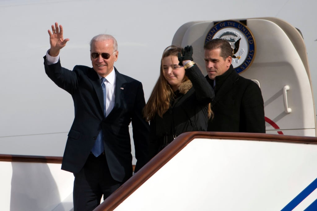 Joe Biden, his granddaughter Finnegan Biden and his son Hunter Biden at Beijing’s airport in 2013. Photo: AP Joe Biden, his granddaughter Finnegan Biden and his son Hunter Biden at Beijing’s airport in 2013. Photo: AP