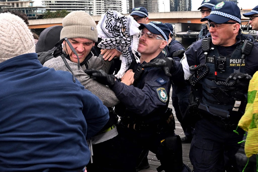 Activists clash with police outside the arms fair in Melbourne on Wednesday. Photo: AFP