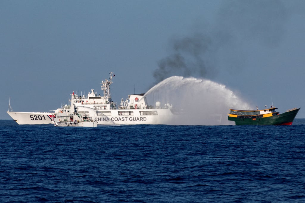 Chinese coastguard vessels fire water cannons towards a Philippine vessel on its way to a resupply mission at Second Thomas Shoal on March 5. Photo: Reuters Chinese coastguard vessels fire water cannons towards a Philippine vessel on its way to a resupply mission at Second Thomas Shoal on March 5. Photo: Reuters