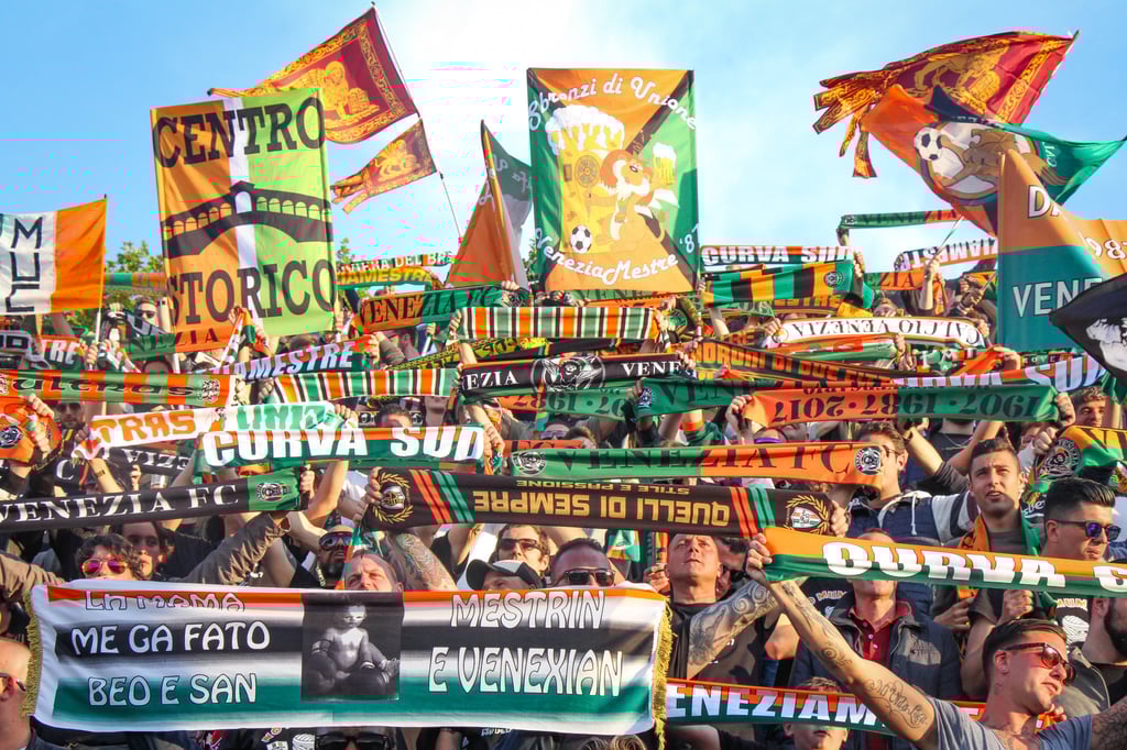 A ritual at the start of each match – supporter groups from Venice and the surrounding region create a mosaic of their distinctive scarves in the Curva Sud stand of Stadio Penzo. Photo: John Brunton A ritual at the start of each match – supporter groups from Venice and the surrounding region create a mosaic of their distinctive scarves in the Curva Sud stand of Stadio Penzo. Photo: John Brunton