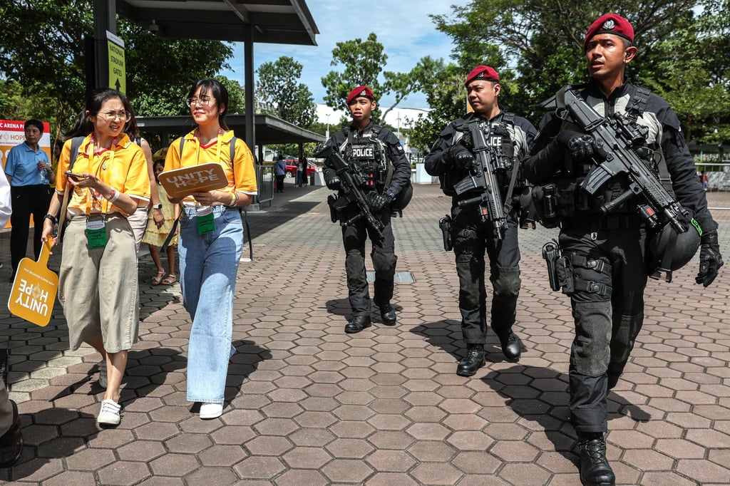 Armed police officers patrol in Singapore. Reports have surfaced recently of illicit activities, including thefts, burglaries and organised crime linked to newly arrived foreigners. Photo: EPA-EFE