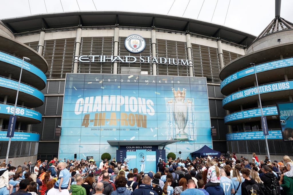 Manchester City fans outside the team’s Etihad Stadium. Photo: Reuters