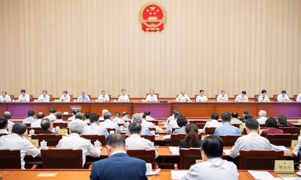 Zhao Leji (centre), chairman of the National People’s Congress (NPC) Standing Committee, presides over the closing meeting of the committee at the Great Hall of the People in Beijing on Friday. Photo: Xinhua