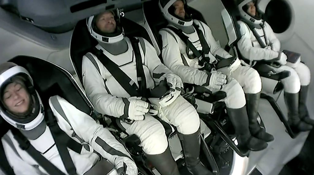 The four-member crew wait to get out of their capsule after it landed in the Gulf of Mexico off Florida early on Sunday. Photo: SpaceX via AP