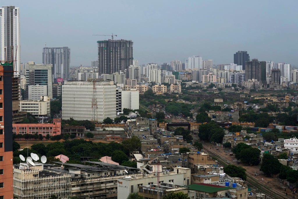 High-rise buildings in Karachi. The city’s population grows by around 2 per cent every year and there’s little effort to protect its historic sites. Photo: AP