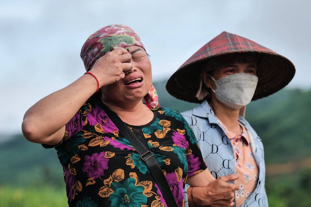 A resident reacts at the site of a landslide in a remote mountainous village in Vietnam’s Lao Cai province on September 12. Photo: AFP