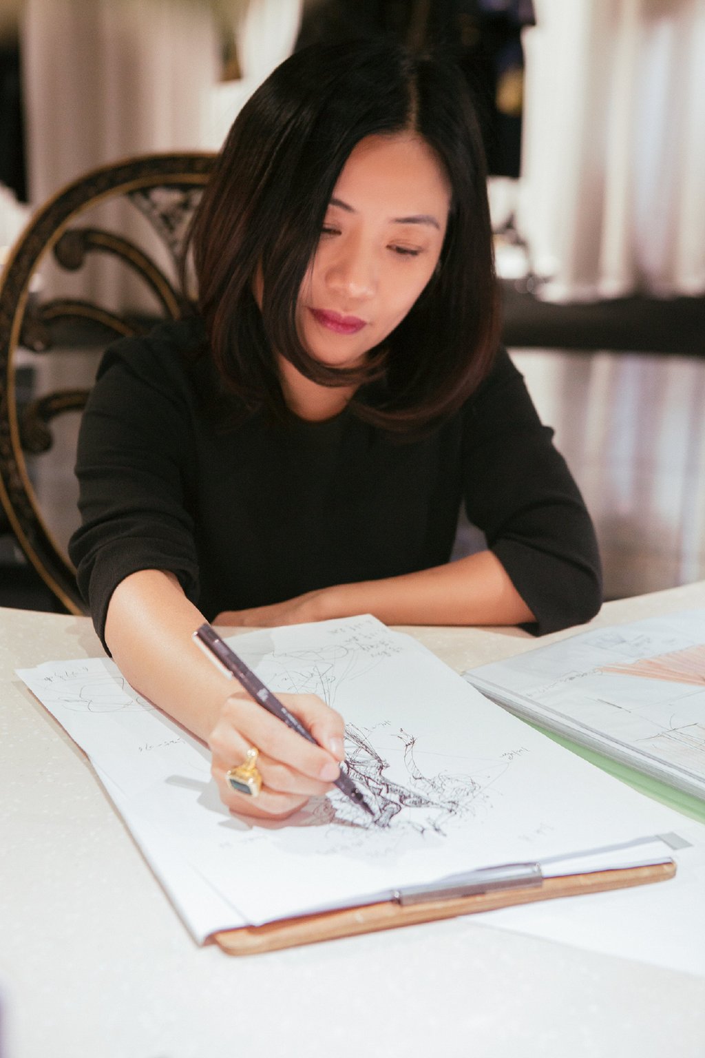 Guo Pei working on a collection sketch. Photo: Courtesy of Guo Pei Guo Pei working on a collection sketch. Photo: Courtesy of Guo Pei