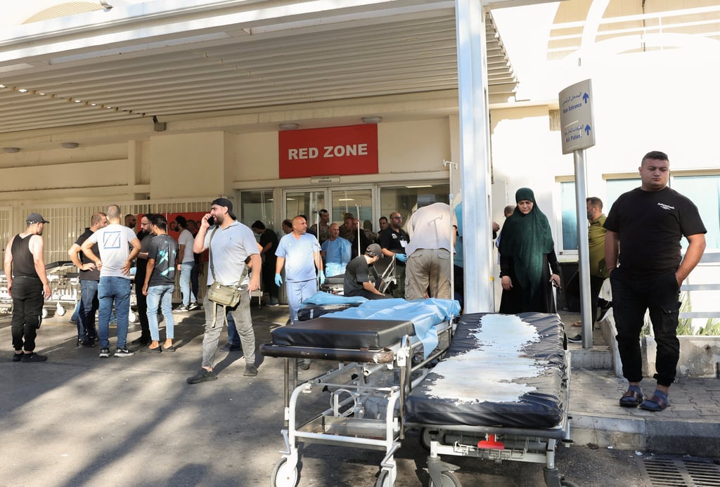 People gather outside a Beirut hospital in the wake of the pager explosions that seriously wounded hundreds of members of the Lebanese armed group Hezbollah. Photo: Reuters People gather outside a Beirut hospital in the wake of the pager explosions that seriously wounded hundreds of members of the Lebanese armed group Hezbollah. Photo: Reuters