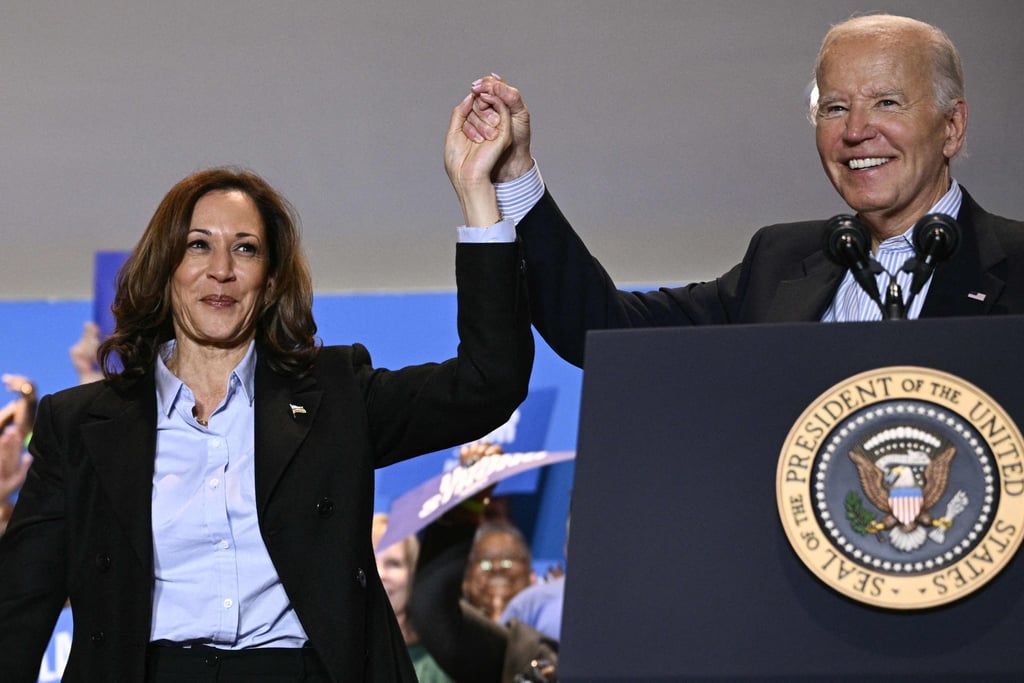 US President Joe Biden holds up Vice President Kamala Harris’ hand during a campaign rally in Pennsylvania. Harris is widely seen as a continuity candidate. Photo: AFP