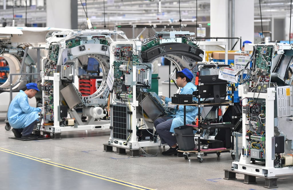 Workers at a CT machine workshop at Neusoft Medical in Shenyang, northeast Liaoning province, on May 22. Firms manufacturing medical devices are an important part of China’s biotech sector. Photo: Xinhua