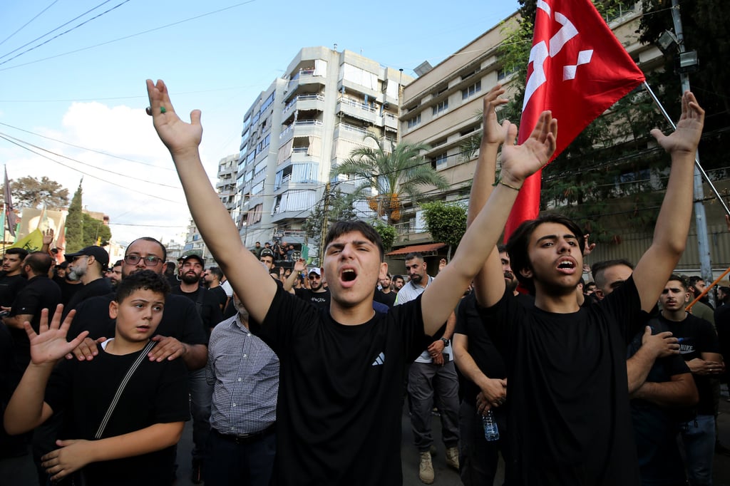 A man shouts slogans on Saturday during the funeral of three Hezbollah commanders who were killed in an Israeli air strike on a Beirut suburb. Photo: dpa A man shouts slogans on Saturday during the funeral of three Hezbollah commanders who were killed in an Israeli air strike on a Beirut suburb. Photo: dpa