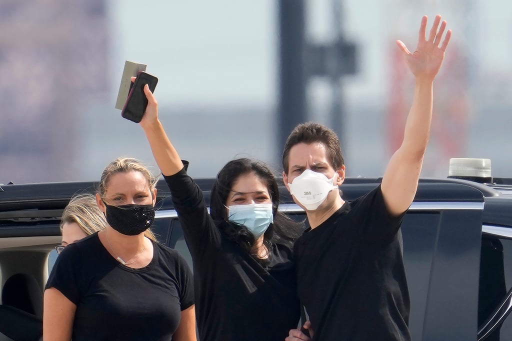 Michael Kovrig, right, waves to media with his wife Vina Nadjibulla, centre, and sister Ariana Botha, left, after his arrival at Pearson International Airport in Toronto in September 2021. Photo: The Canadian Press via AP Michael Kovrig, right, waves to media with his wife Vina Nadjibulla, centre, and sister Ariana Botha, left, after his arrival at Pearson International Airport in Toronto in September 2021. Photo: The Canadian Press via AP