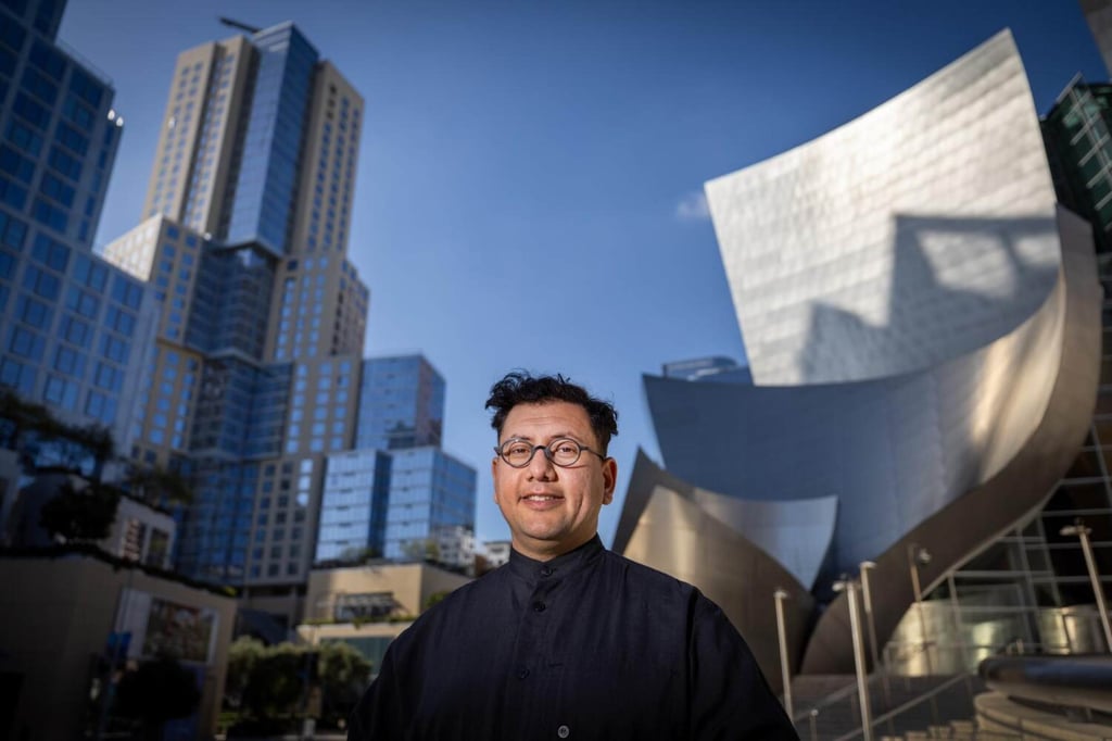 Refik Anadol in front of The Grand LA (left) and Walt Disney Concert Hall (right), in Los Angeles. Photo: TNS Refik Anadol in front of The Grand LA (left) and Walt Disney Concert Hall (right), in Los Angeles. Photo: TNS