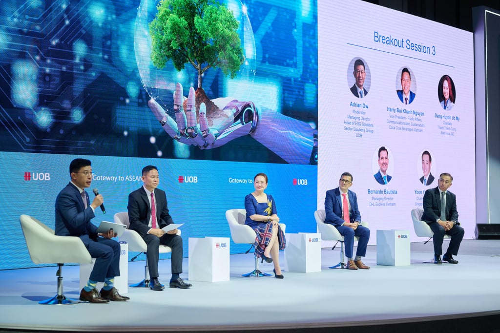 A panel about Asean’s readiness in the new green economy featured (from left) moderator Adrian Ow, head of ESG solutions at UOB; Harry Bui Khanh Nguyen, vice-president of public affairs, communications and sustainability at Coca-Cola Beverages Vietnam; Dang Huynh Uc My, chairwoman of Thanh Thanh Cong; Bernardo Bautista, managing director of DHL Express Vietnam; and Yoon Young Kim, cluster president of Singapore and Brunei for Schneider Electric. A panel about Asean’s readiness in the new green economy featured (from left) moderator Adrian Ow, head of ESG solutions at UOB; Harry Bui Khanh Nguyen, vice-president of public affairs, communications and sustainability at Coca-Cola Beverages Vietnam; Dang Huynh Uc My, chairwoman of Thanh Thanh Cong; Bernardo Bautista, managing director of DHL Express Vietnam; and Yoon Young Kim, cluster president of Singapore and Brunei for Schneider Electric.