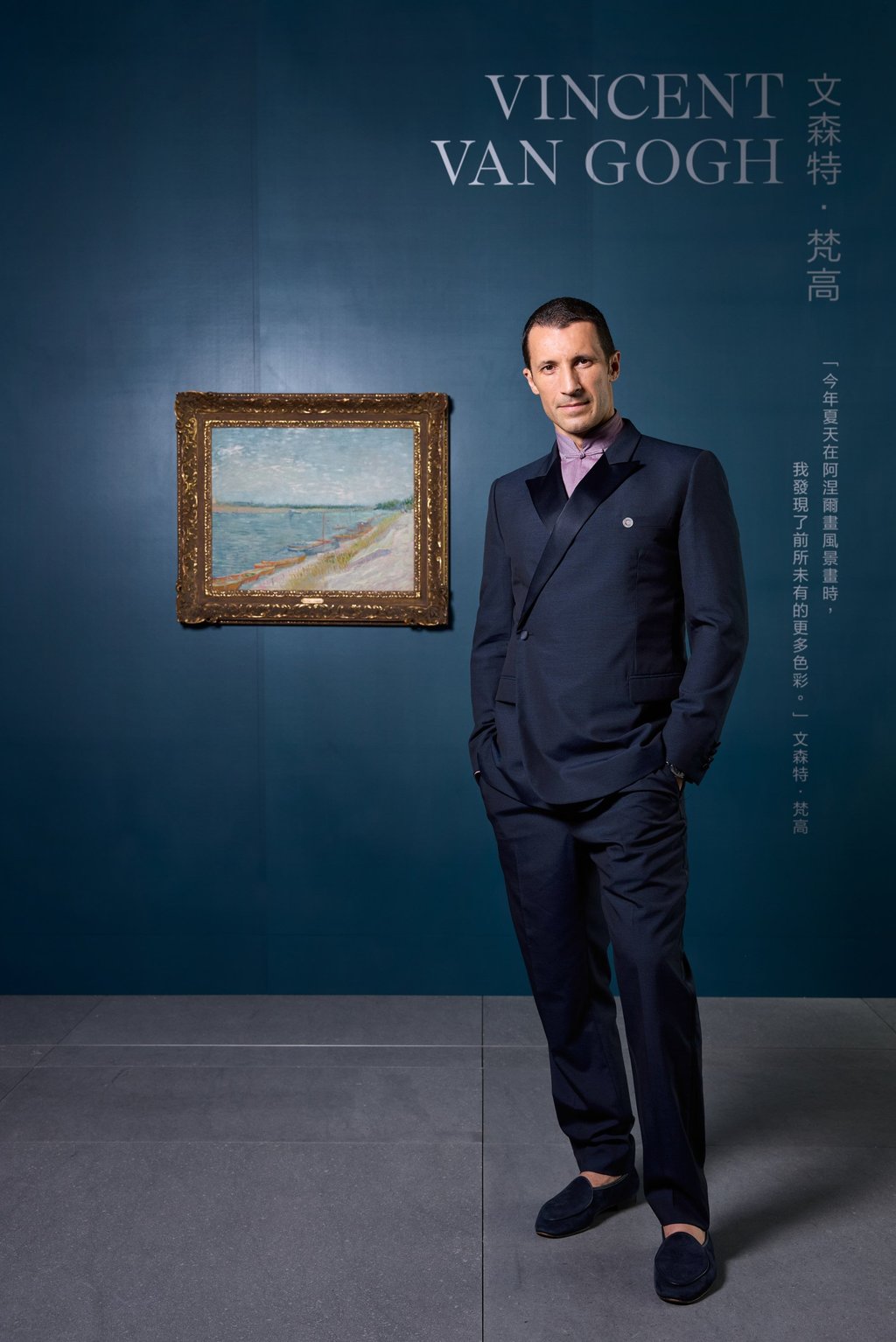 Cristian Albu, deputy chairman and head of 20th/21st century art at Christie’s Asia-Pacific, poses with Vincent van Gogh’s Les canots amarrés (1887) ahead of its sale. Photo: Christie’s Images Ltd. 2024