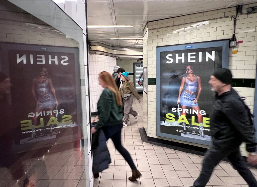 People walk past an advertisement for Shein in London, March 8, 2024. Photo: Reuters