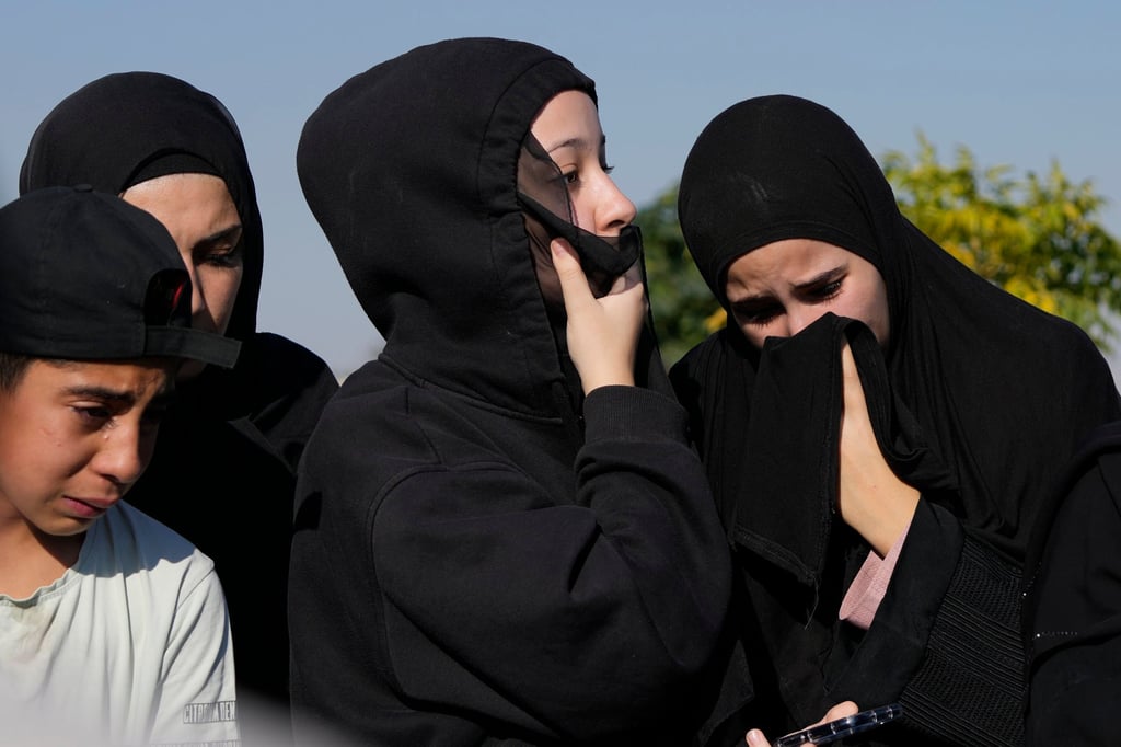 Mourners react during the funeral procession on Friday of relatives killed in Israeli air strikes on a village in eastern Lebanon. Photo: AP