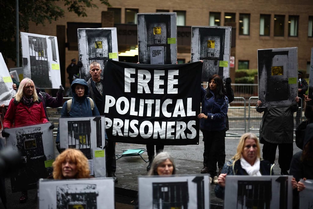 Supporters of Just Stop Oil activists Phoebe Plummer and Anna Holland gather with placards outside Southwark Crown Court in London on Friday. Photo: AFP Supporters of Just Stop Oil activists Phoebe Plummer and Anna Holland gather with placards outside Southwark Crown Court in London on Friday. Photo: AFP